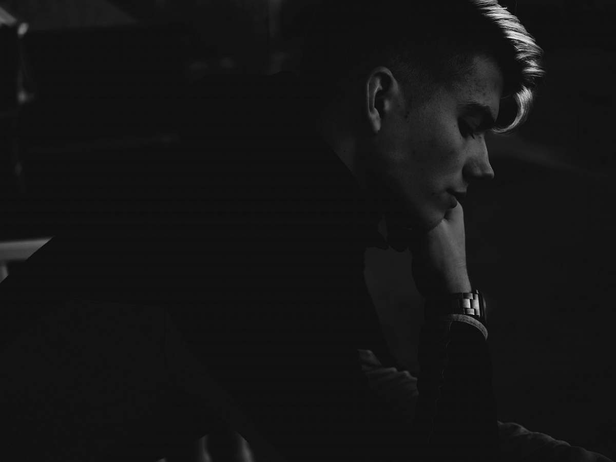 person grayscale photo of man black-and-white