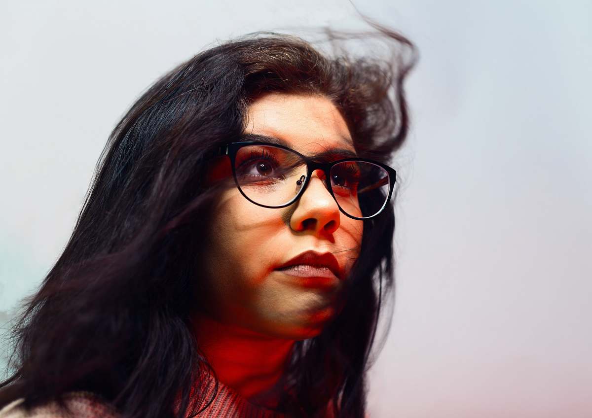 people woman wearing eyeglasses looking up glasses