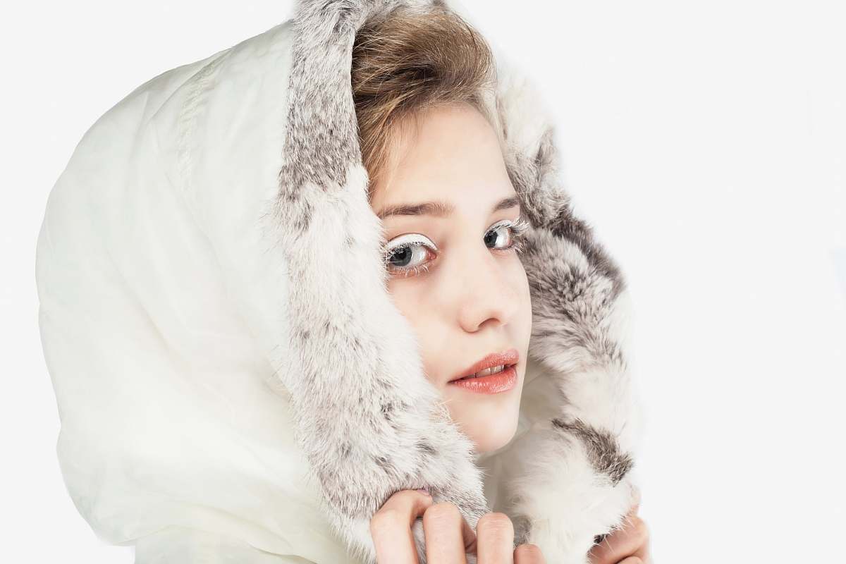 people woman wearing white hoodie posing person