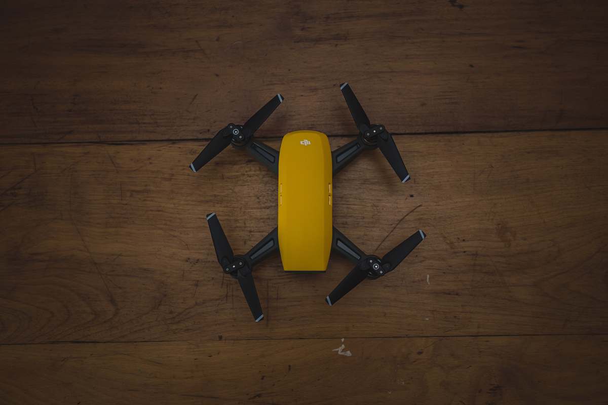 plywood yellow and black drone on wooden surface small