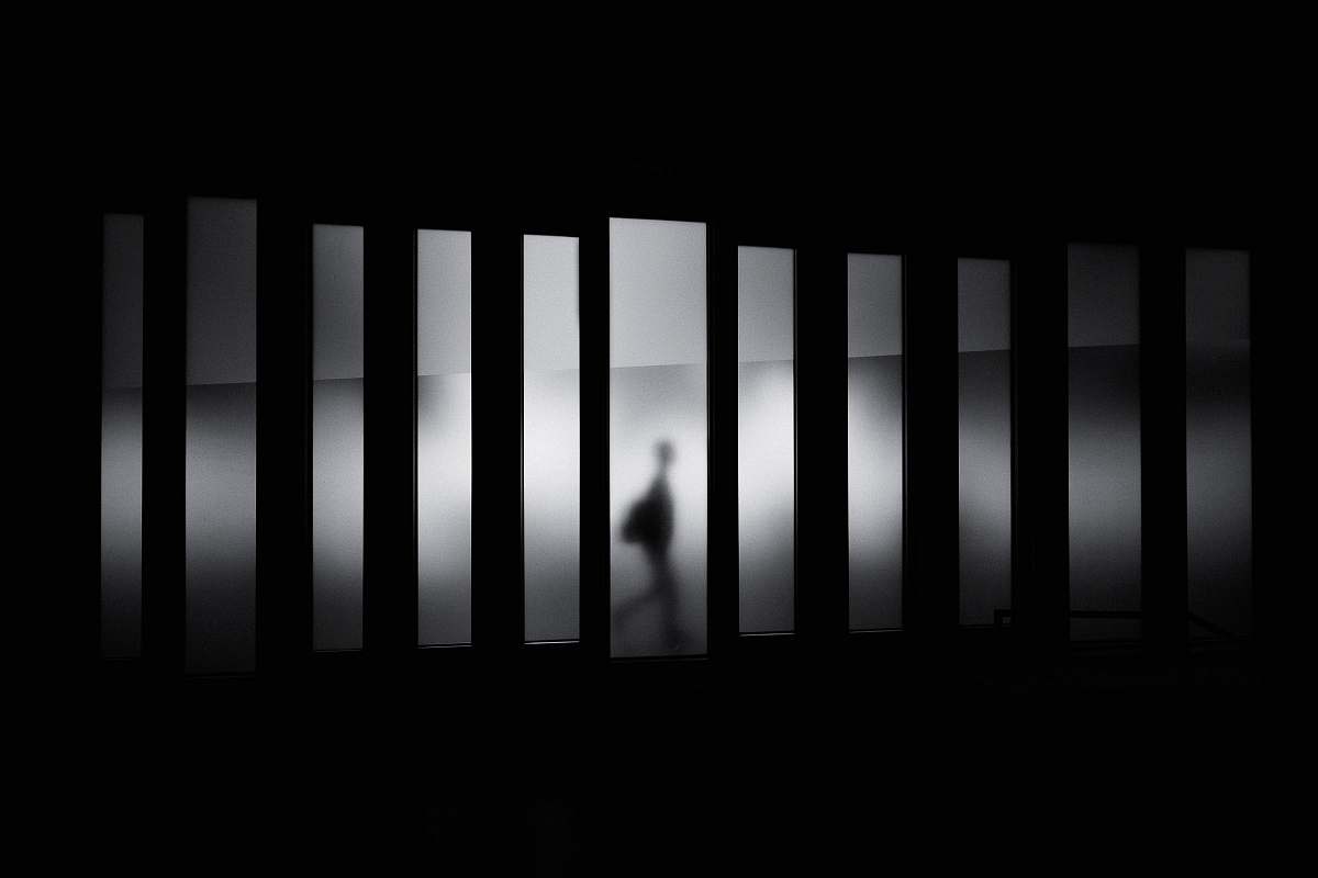 black-and-white grayscale photo of person running in panel paintings black