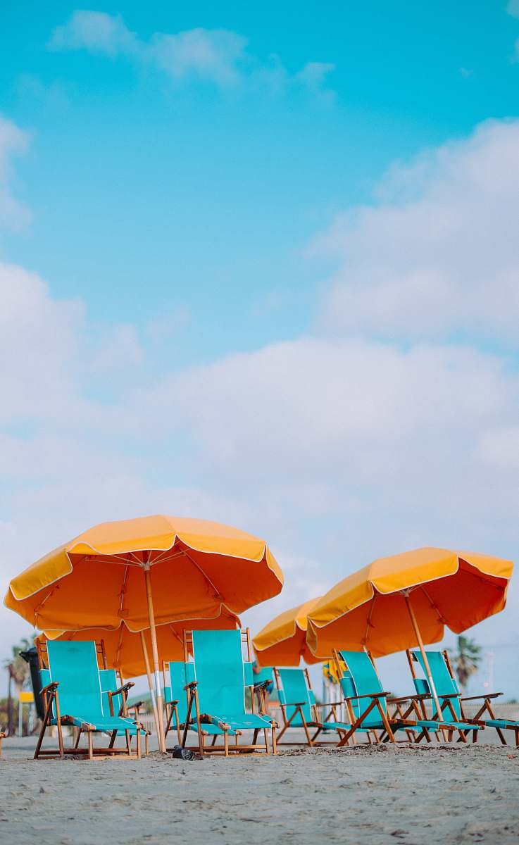 chair closeup photo of lounger chairs and beach umbrellas umbrella