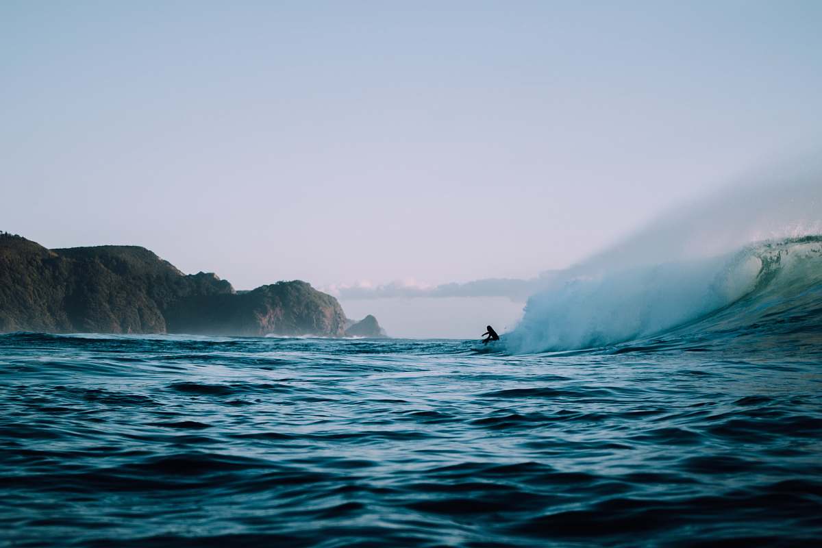 water ocean near mountains during daytime ocean