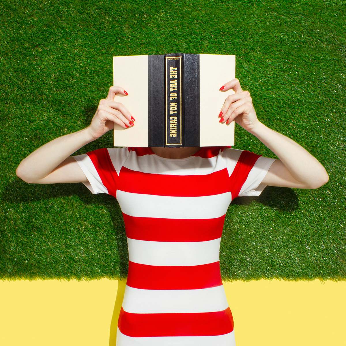 akron person holding black and beige book united states