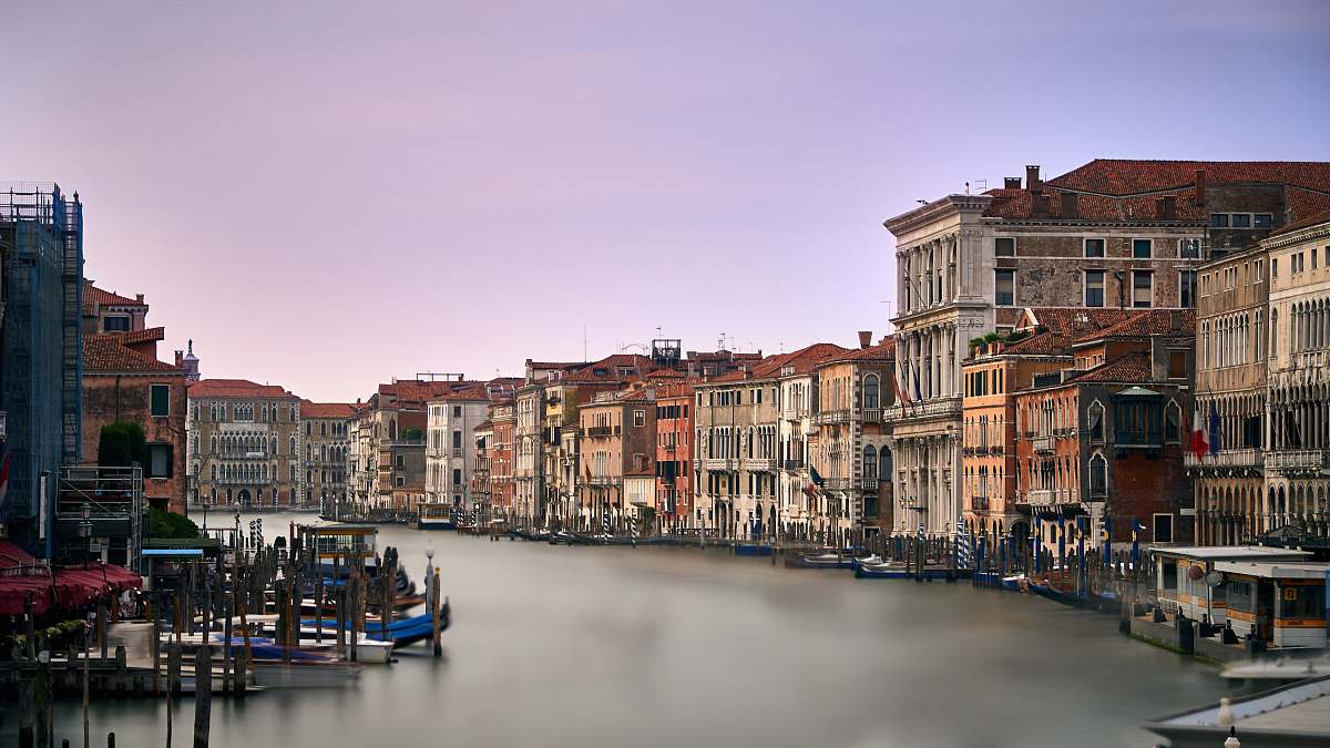 italy body of water surrounded by houses boat