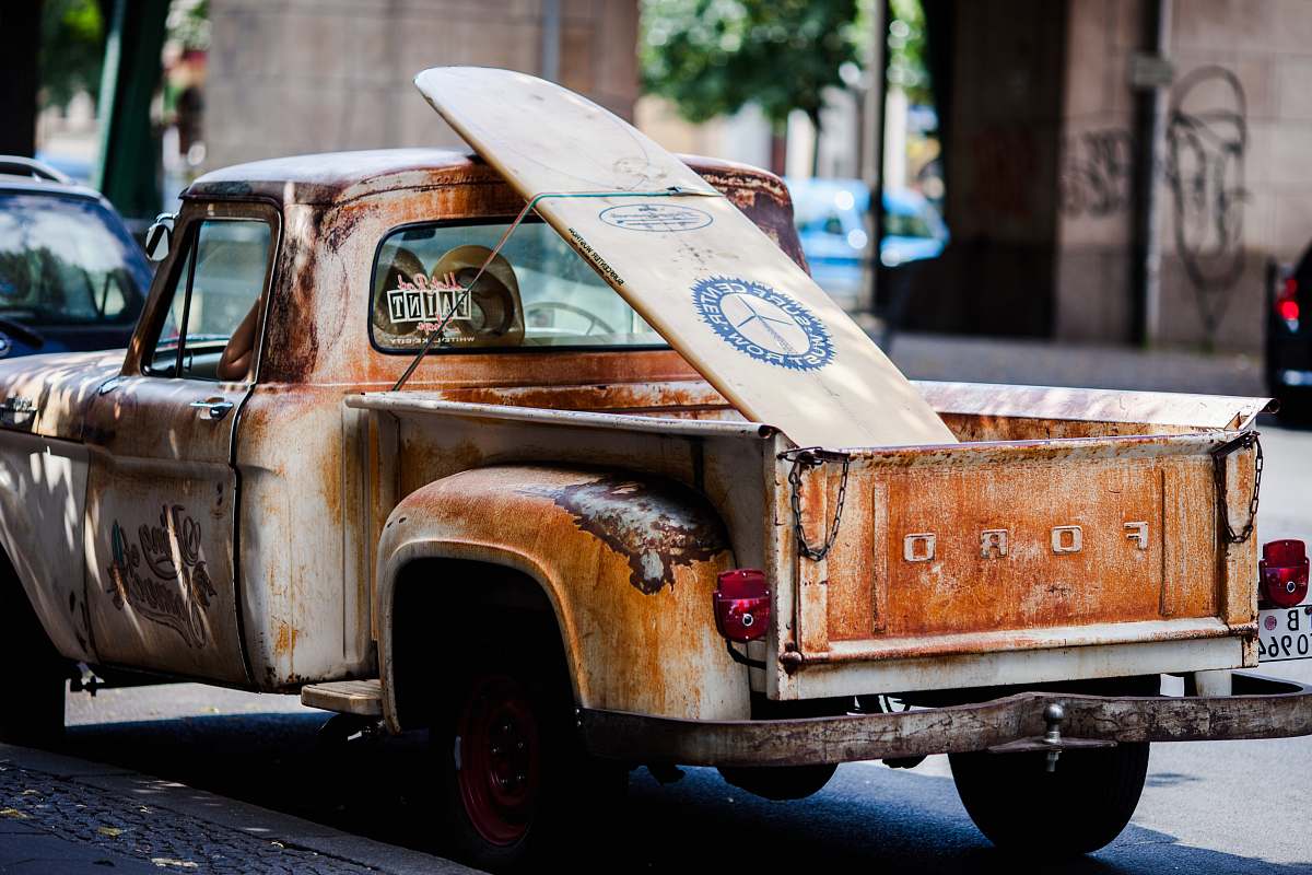 transportation vintage brown and white Ford single-cab pickup truck parked on pavements vehicle