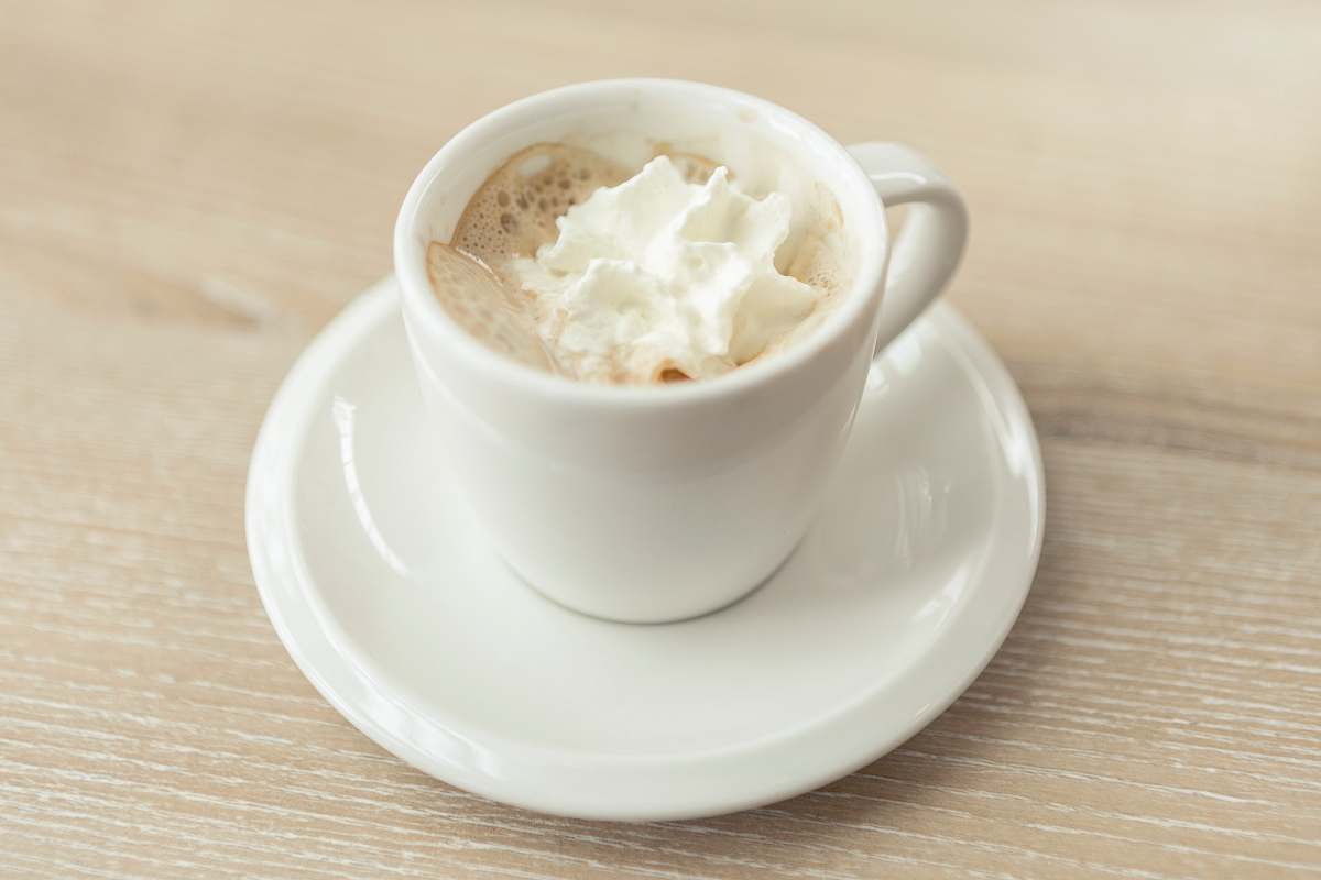 saucer espresso con panna in white cup whipped cream