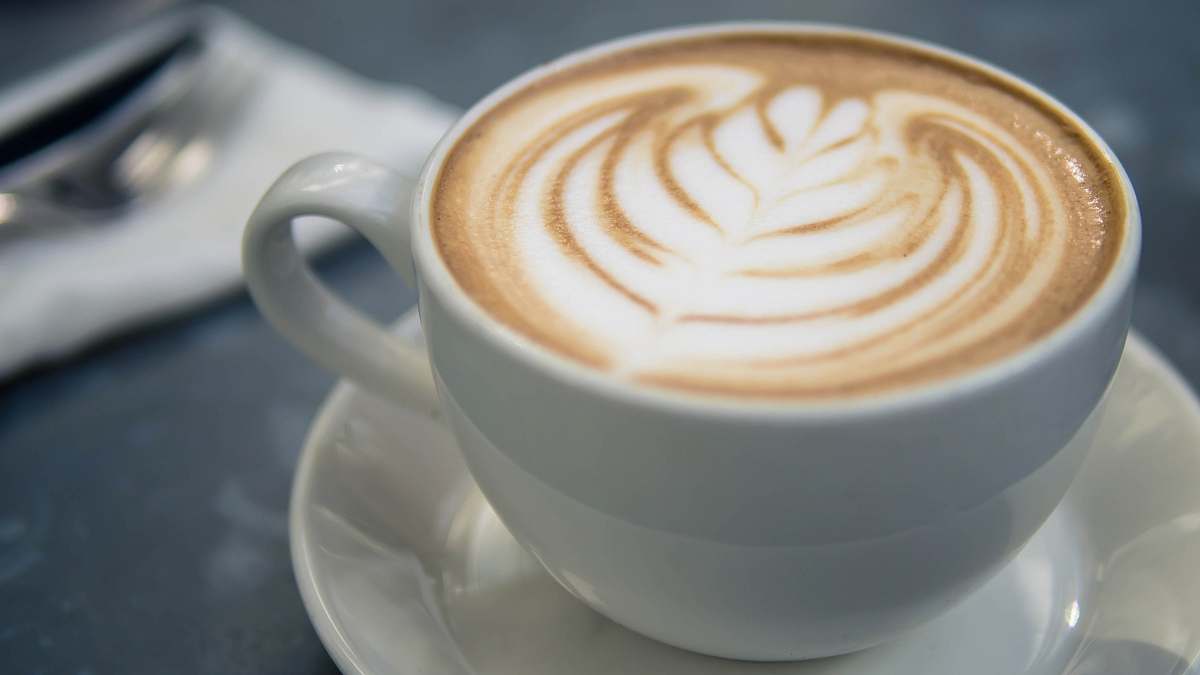 drink coffee latte in white ceramic mug beverage