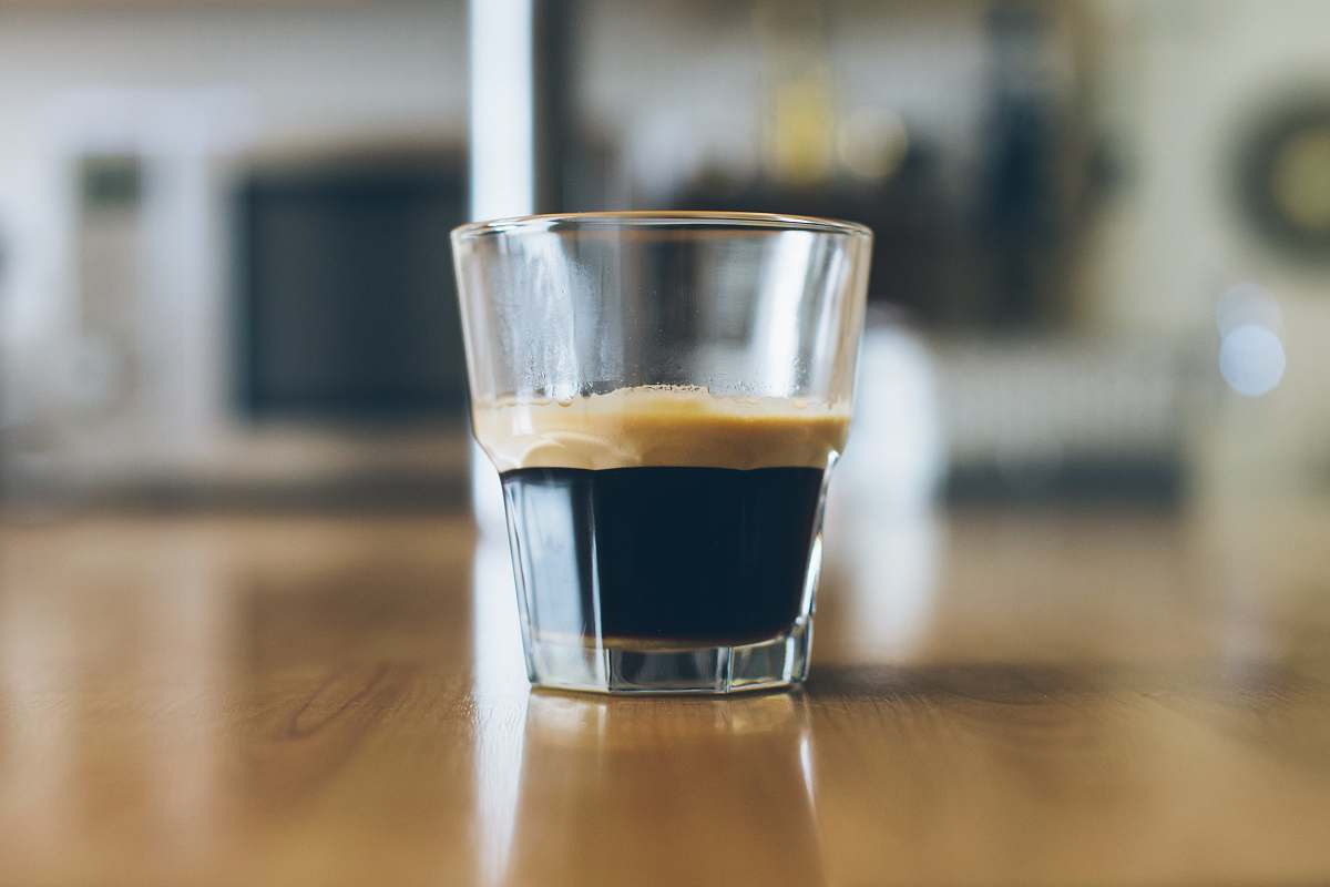 coffee clear shot glass on wooden table beverage