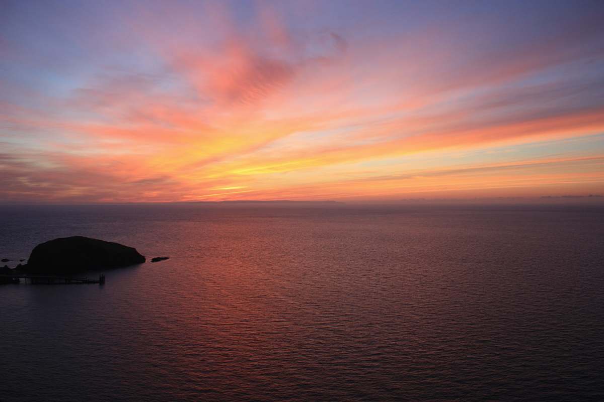 sunrise body of water during horizon dawn