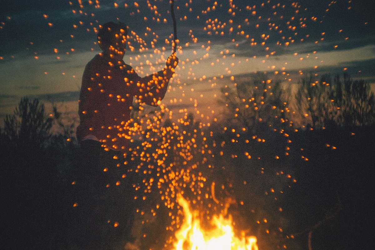 sparks man playing bone fire camp