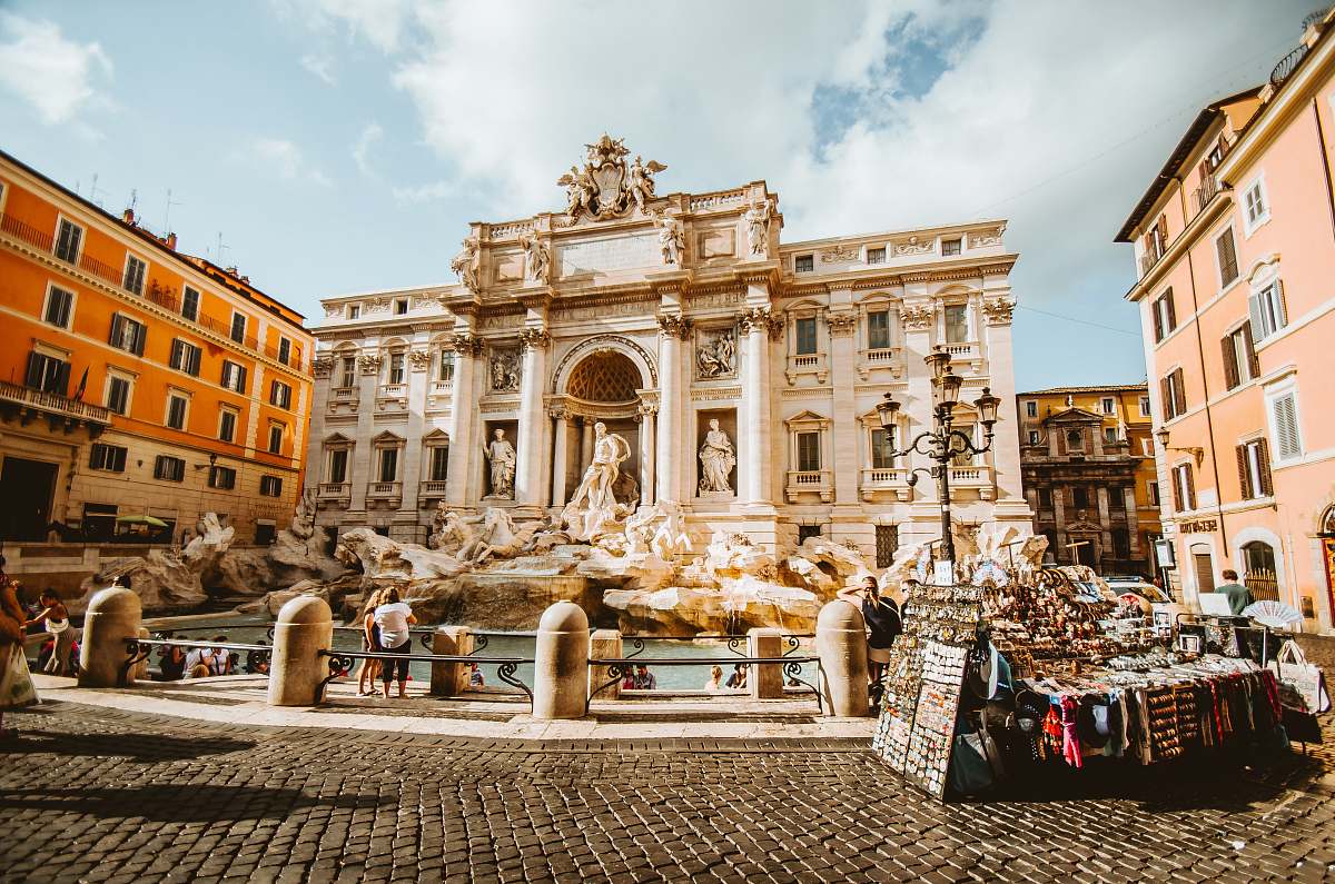 architecture man standing in front of statue rome