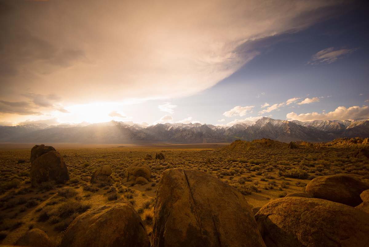 landscape brown desert under cloudy sky mountains