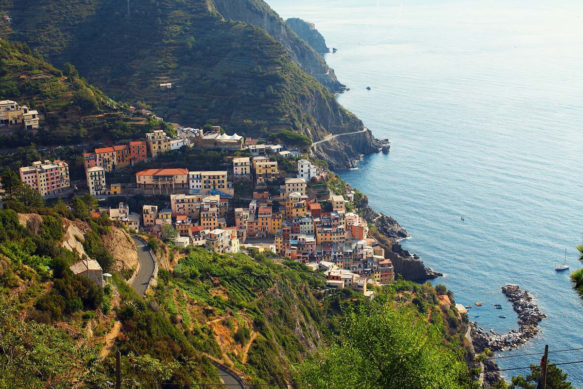 city high angle photo of buildings on mountain slope cliff