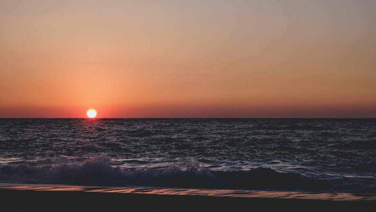 sea landscape photography of body of water during sunset greece