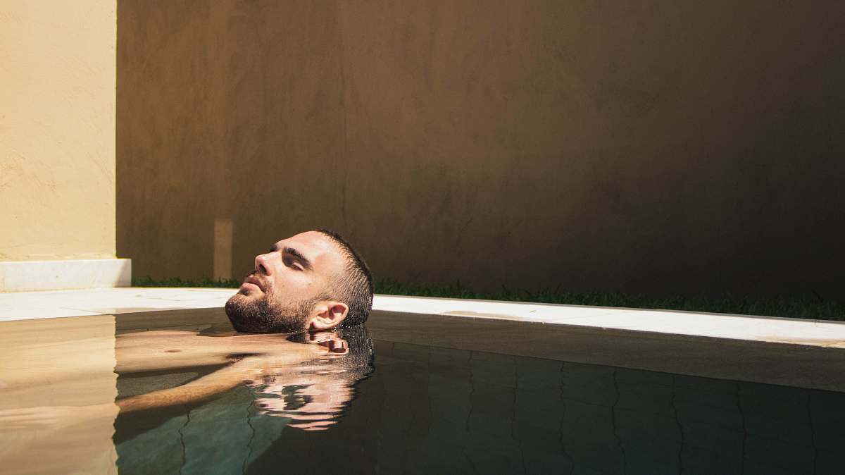 human man floating on water face