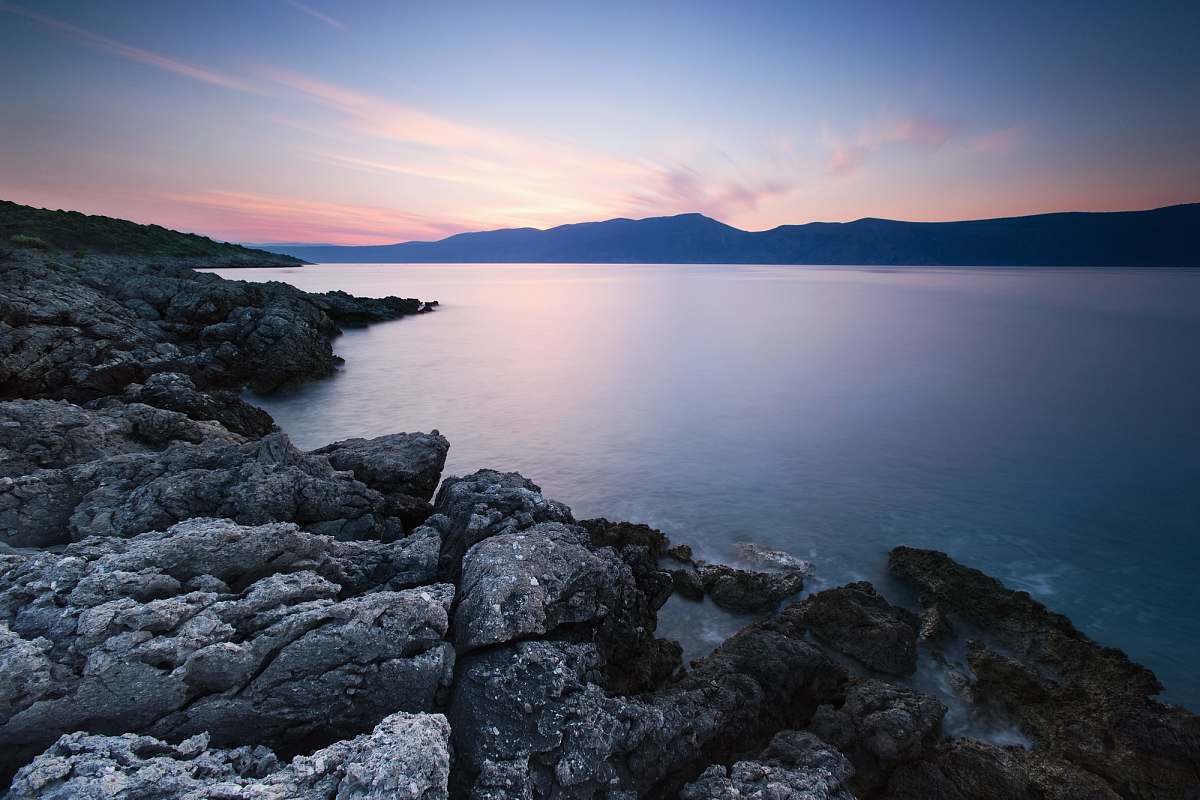 nature gray rock formation near body water rocks