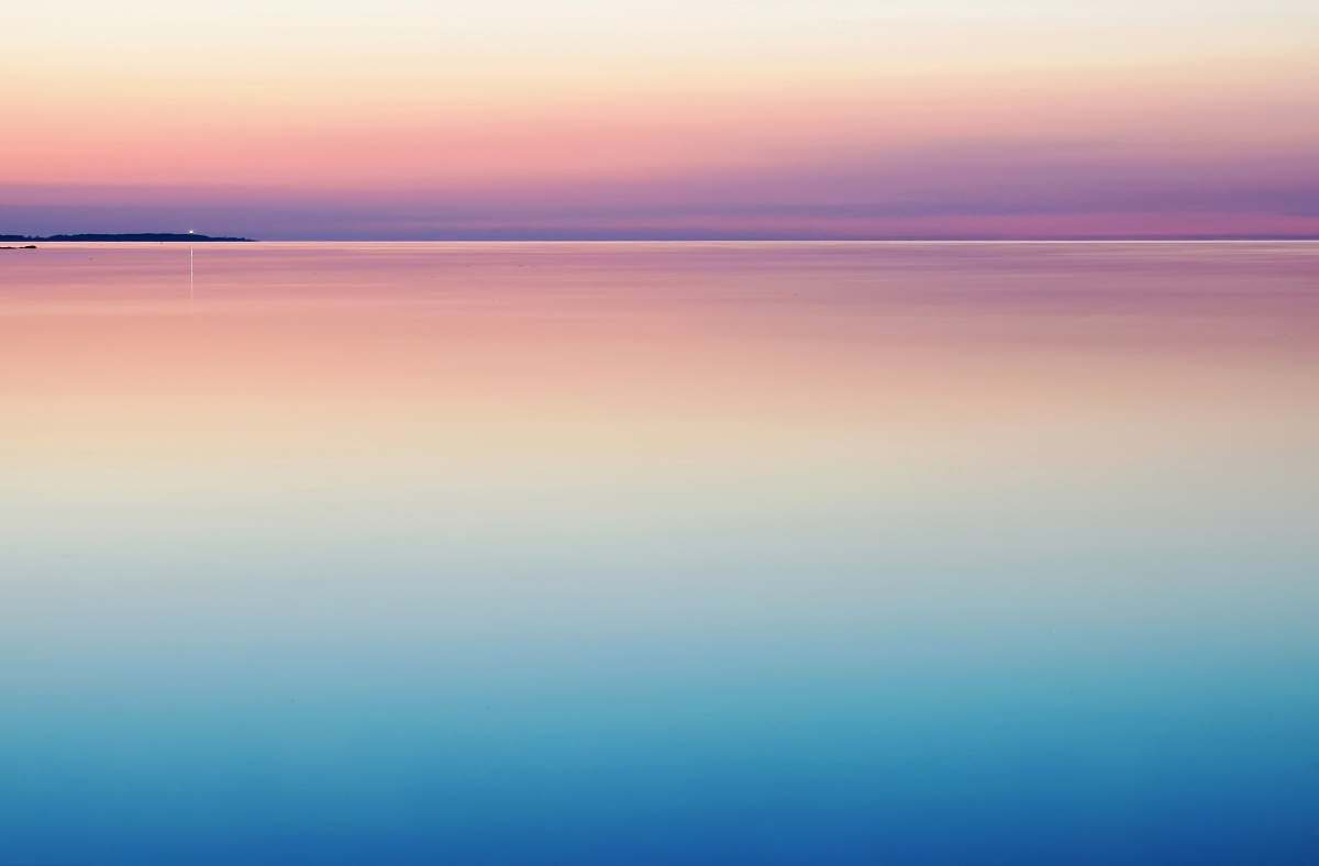 horizon photo of blue and pink sea pastel