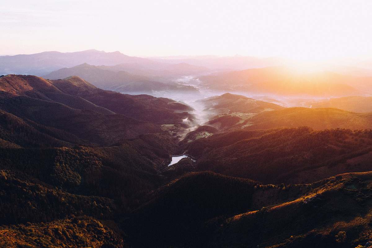 mountain aerial photography of mountain and river view during daytime mountain range