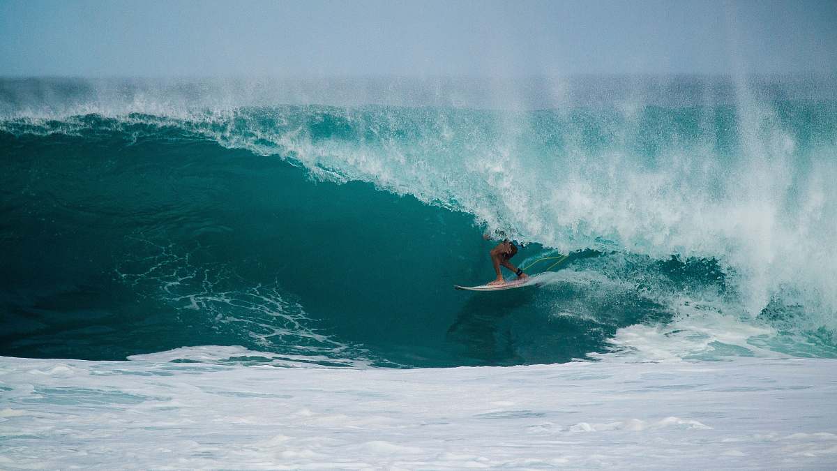 water person surfing on a water wave surfing