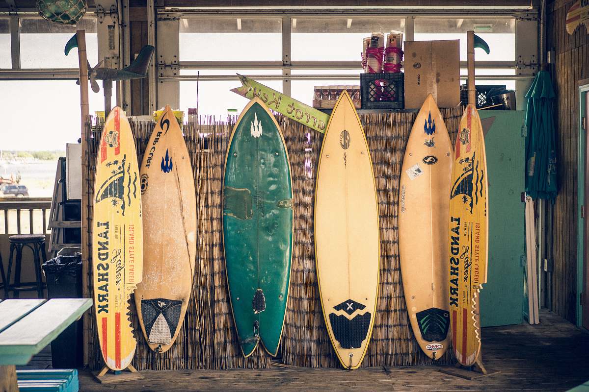 surfboard six assorted-color surfboards on brown board sports
