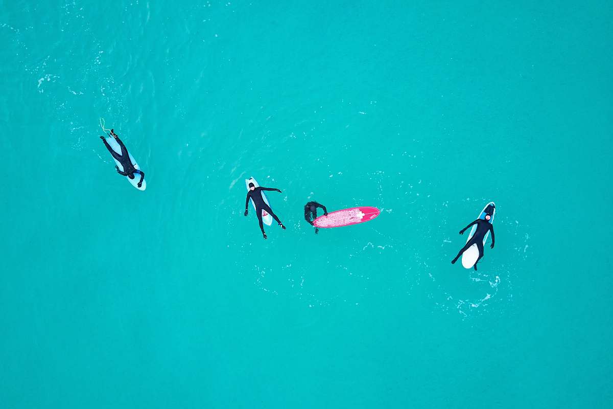 water four person on body of water norway