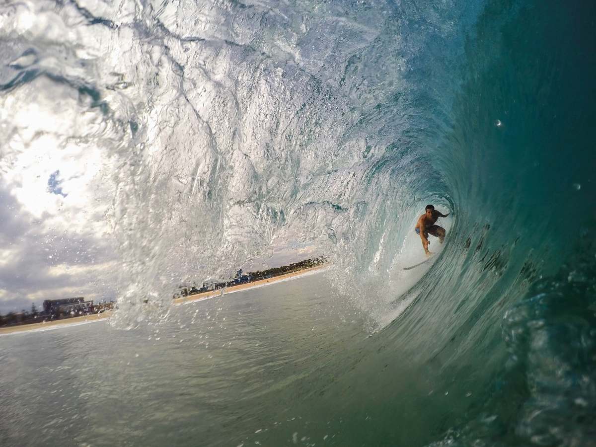 surfing man surfing during daytime water