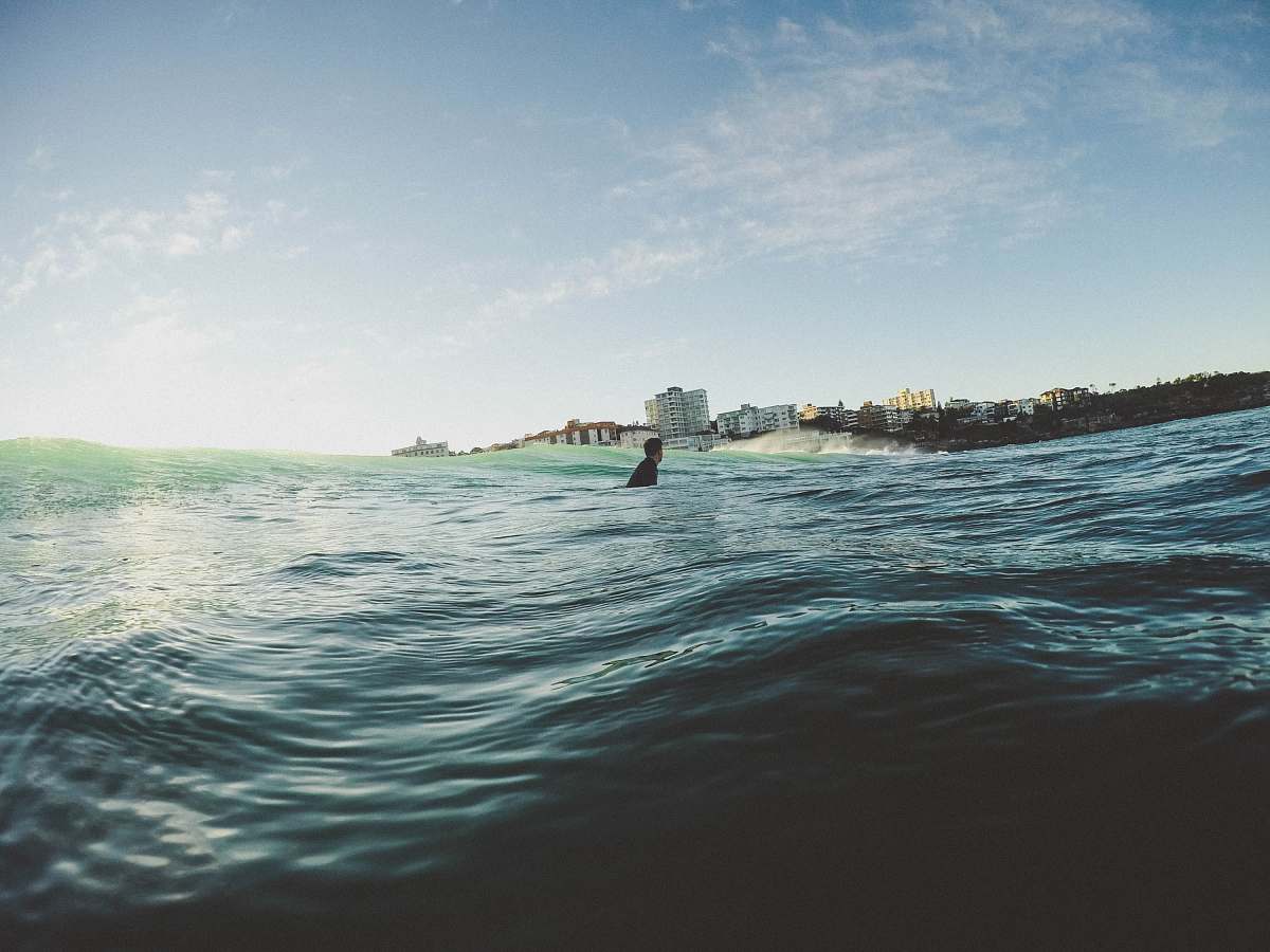 australia man on body of water during daytime surf