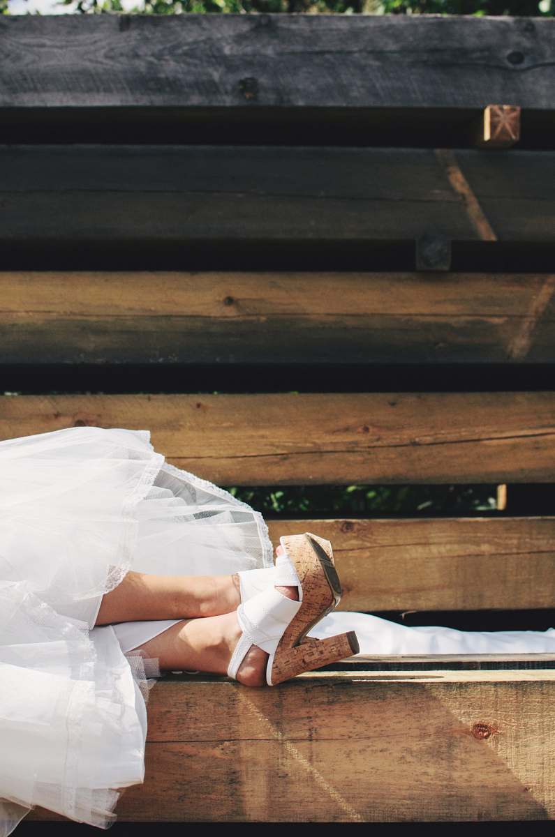 heels person wearing brown-and-white chunky heels during daytime bride