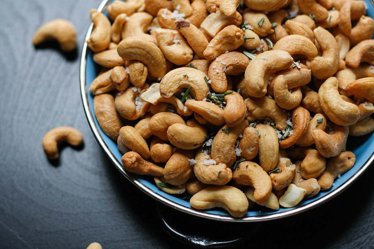 nuts cashew nut lot on blue ceramic bowl cashew