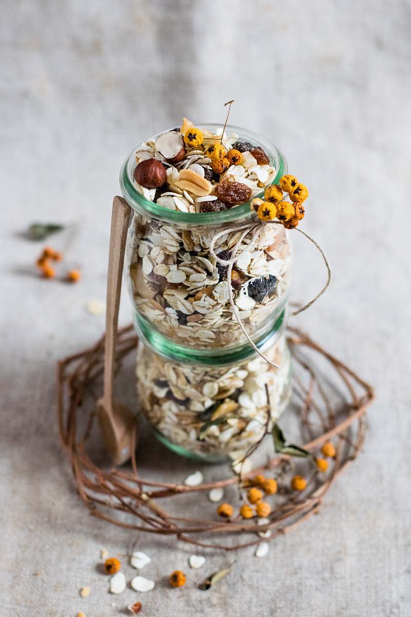 oats clear glass bottle on gray textile muesli