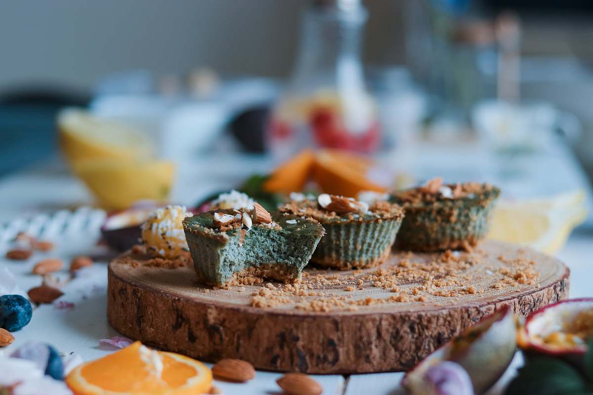dessert cupcakes on brown wood slab food styling