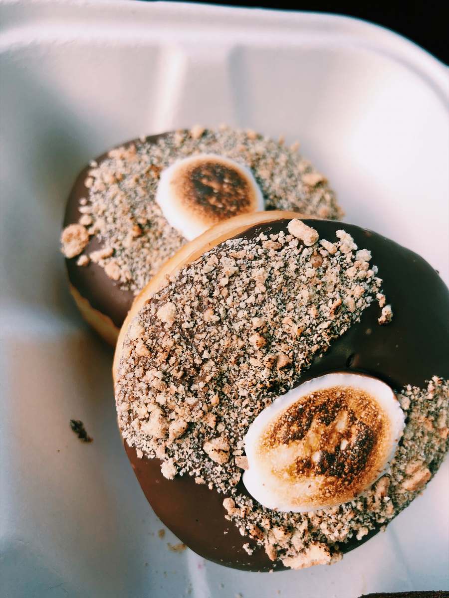 bread two doughnut with chocolate coat in bowl bagel