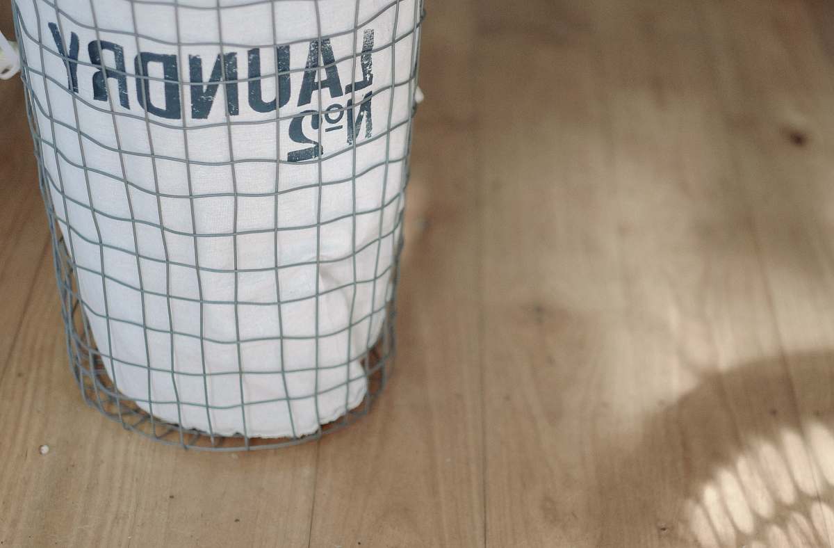 housework white laundry basket on wood floor brisbane city