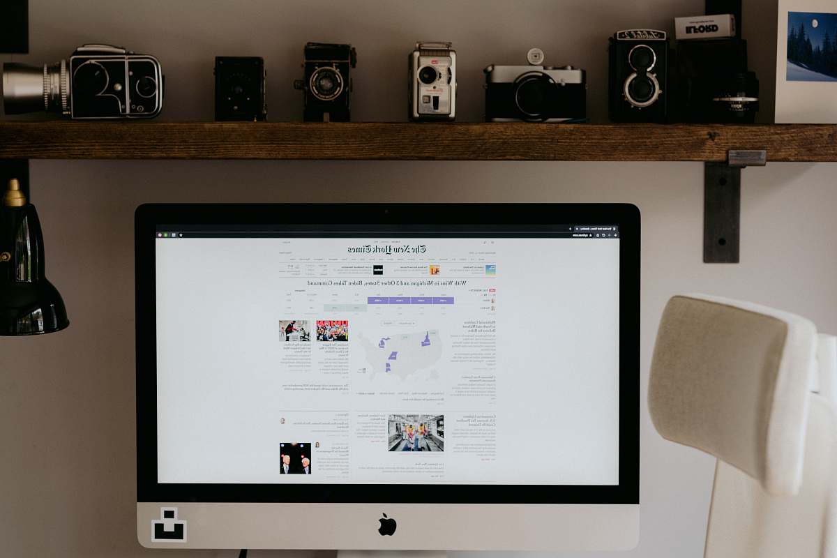 electronics silver imac on brown wooden table monitor