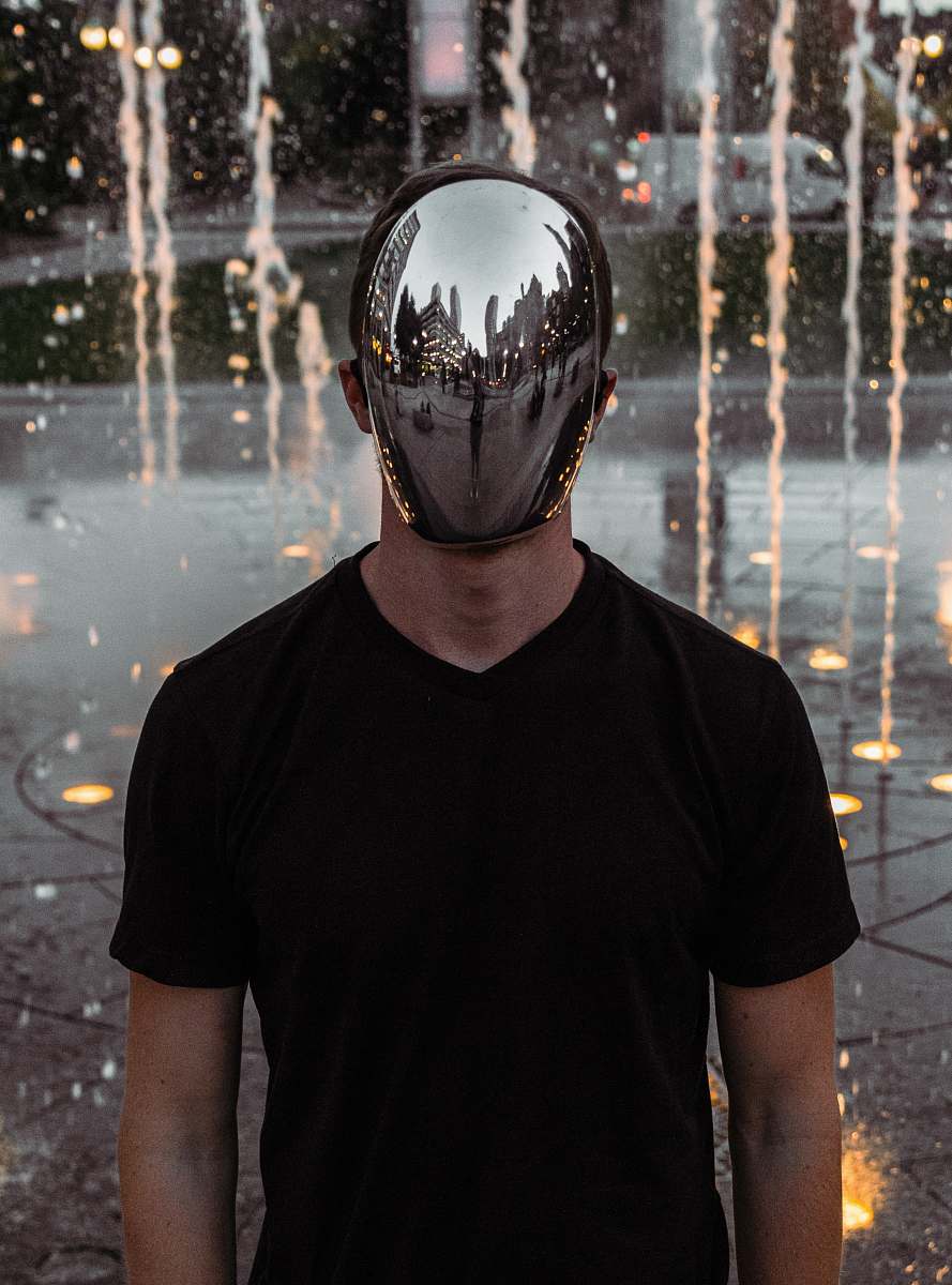 human man covering his face standing person