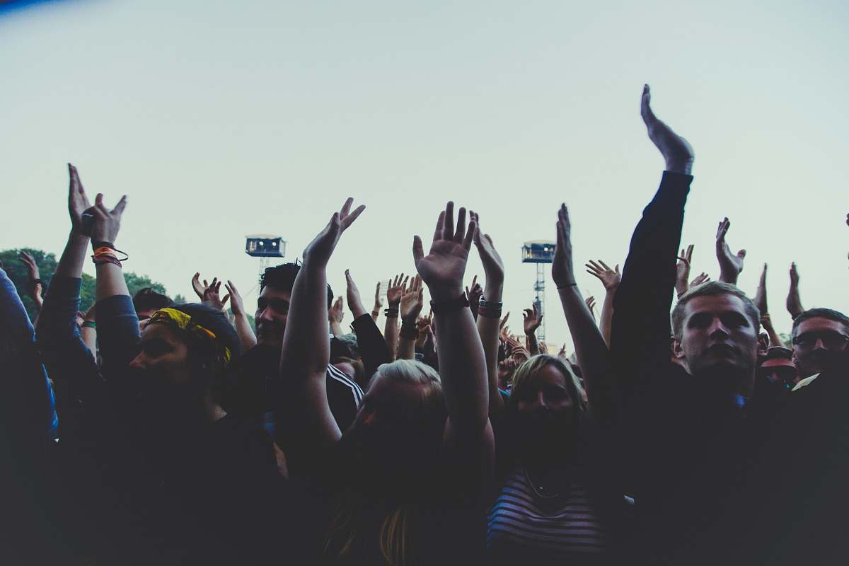 audience photography of people gathering near outdoor during daytime rock