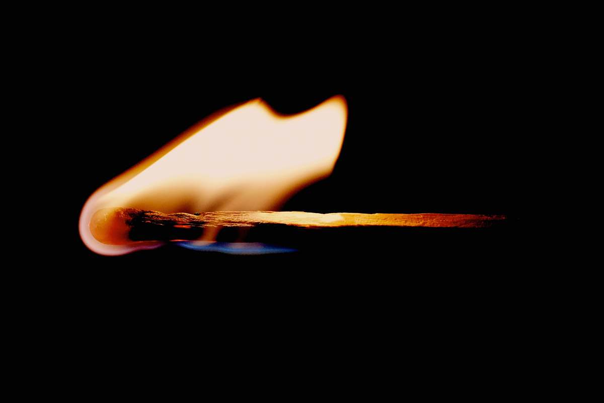 flame lit matchstick matchstick