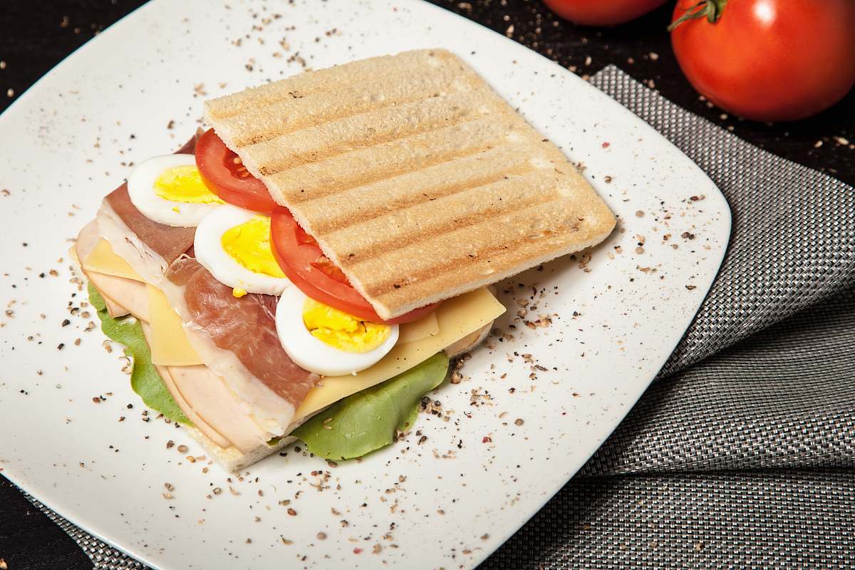 tomato sandwich on top white plate meal