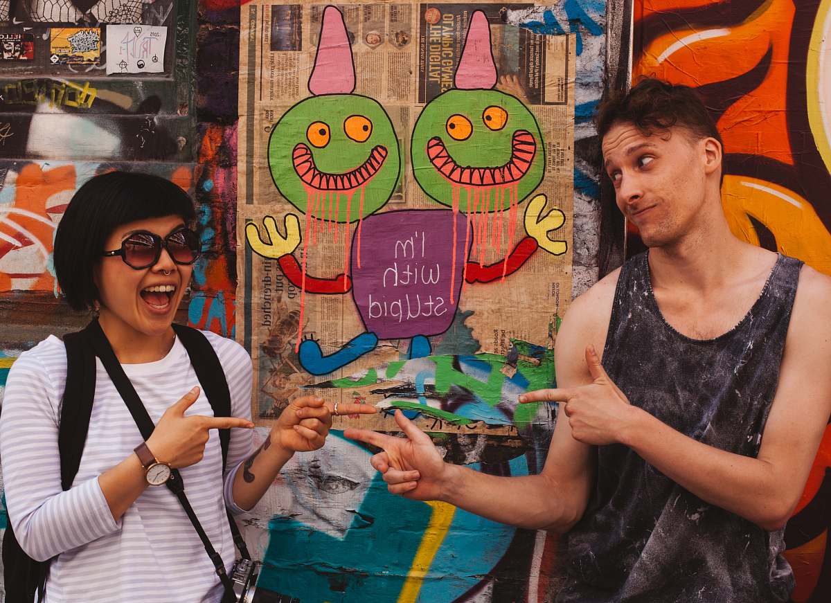 person couple near mural apparel