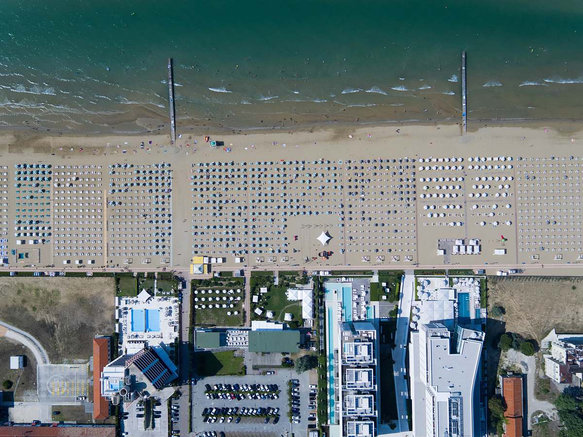 coast bird's eye photography of buildings near body of water building