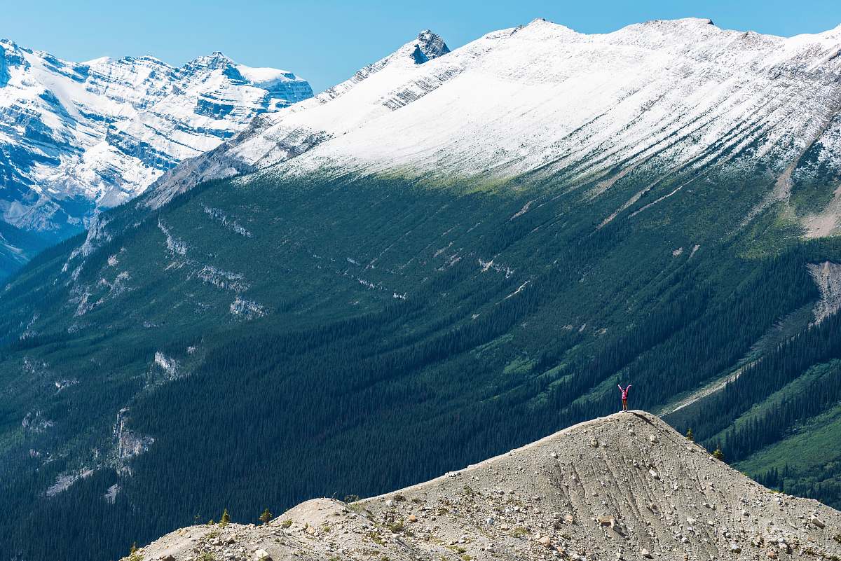 peak man standing on mountain canada