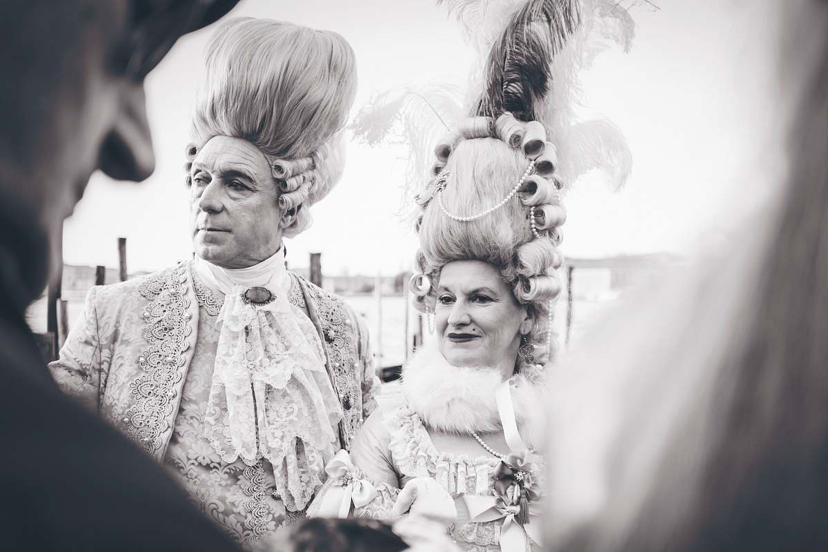 human black and white photography of man and woman in costume person