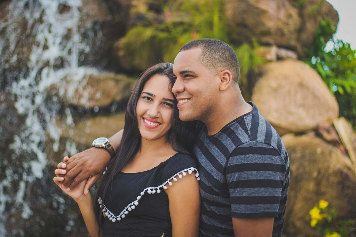 human man and woman taking picture while holding their hands person