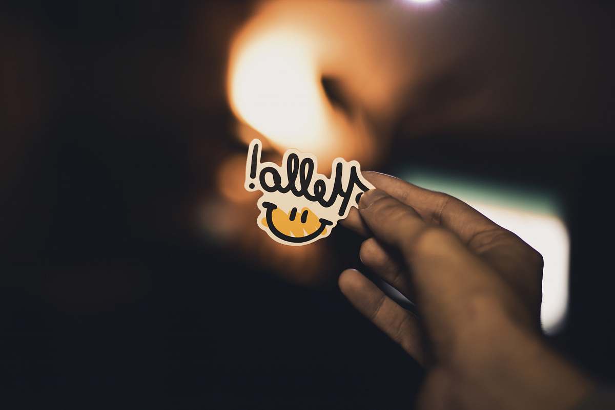 human person holding Hello! sticker person