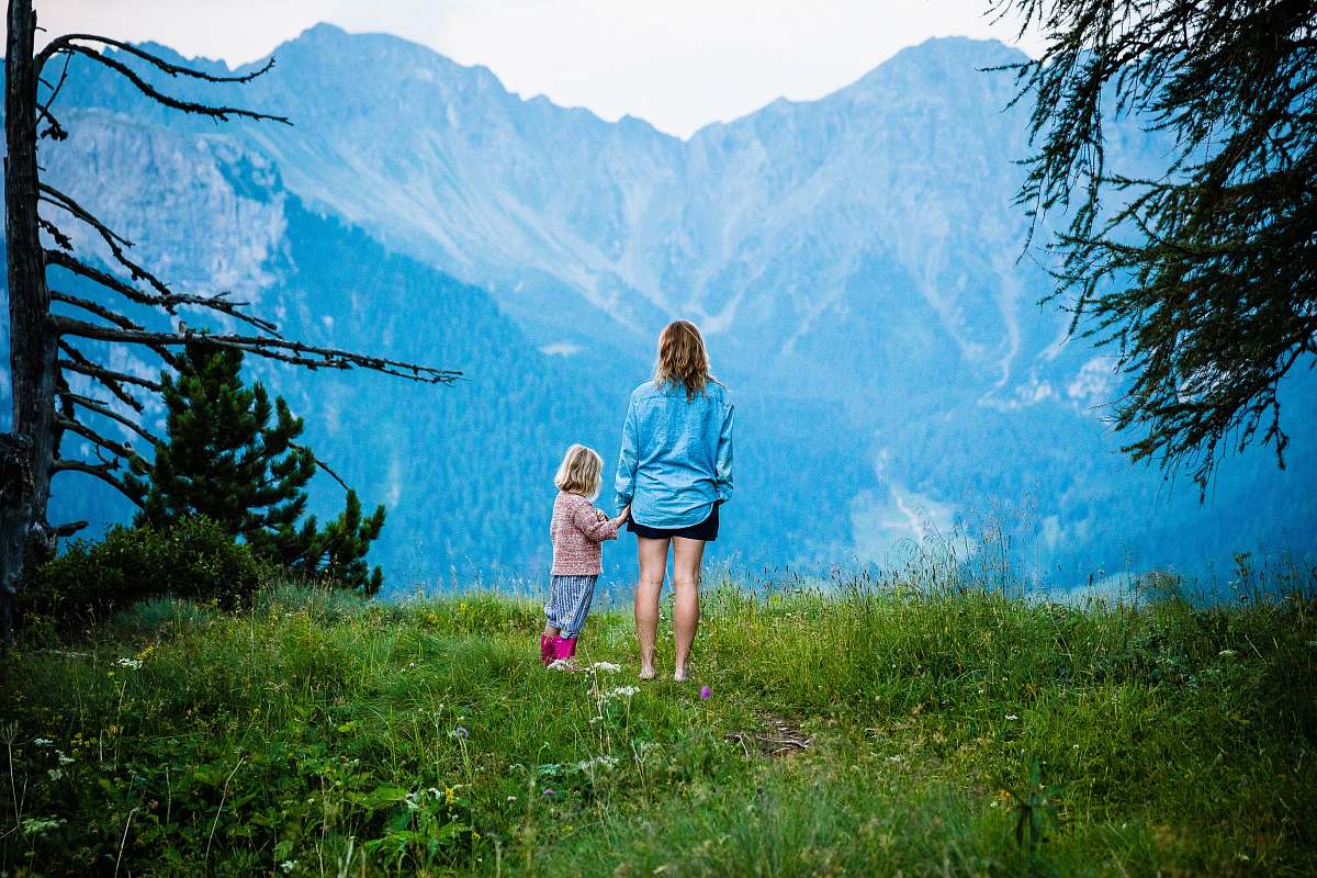 person woman and child standing on mountain human