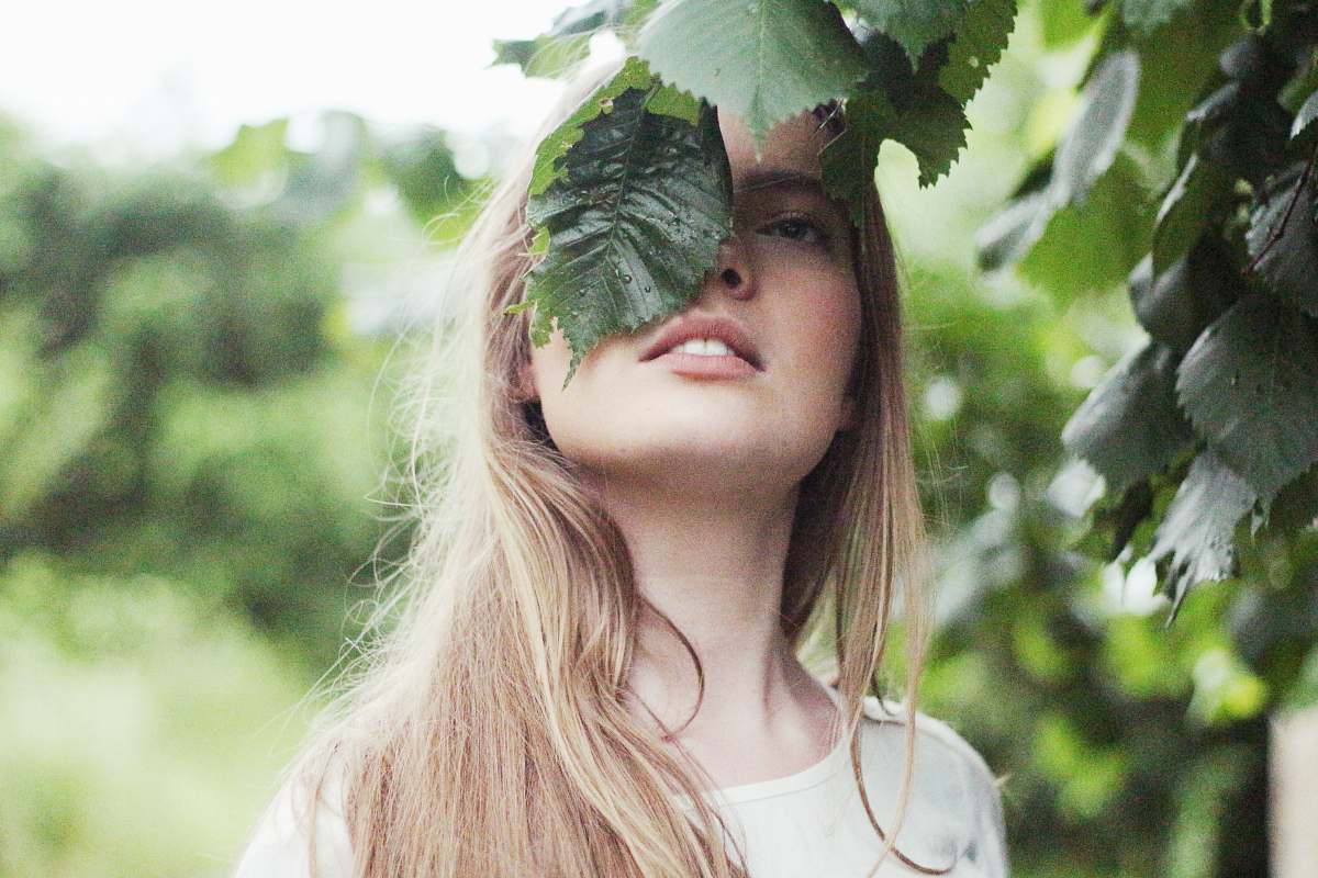 woman woman standing near green leaf tree human
