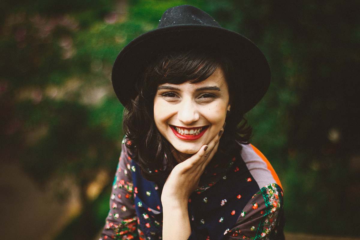 person woman with red lipstick smiling woman
