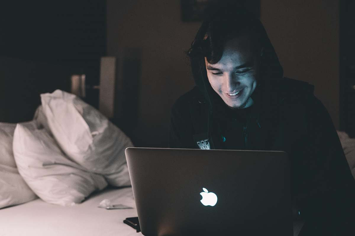 people person using MacBook in bed human