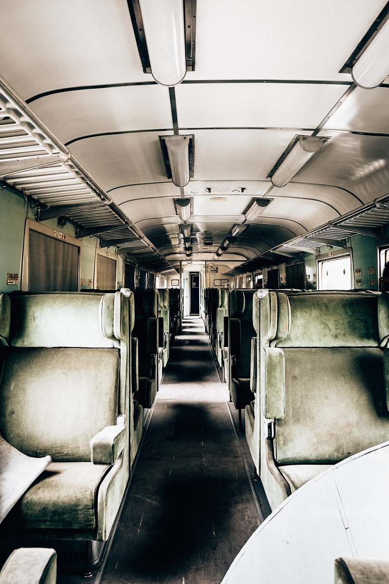 train green and white train interiors vehicle